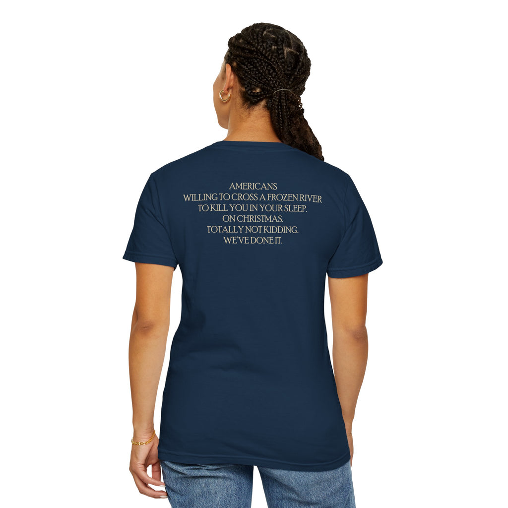 Back of female model wearing America's First Christmas meme t-shirt with 'AMERICANS Willing to cross a frozen river to kill you in your sleep. On Christmas.' quote. True Navy