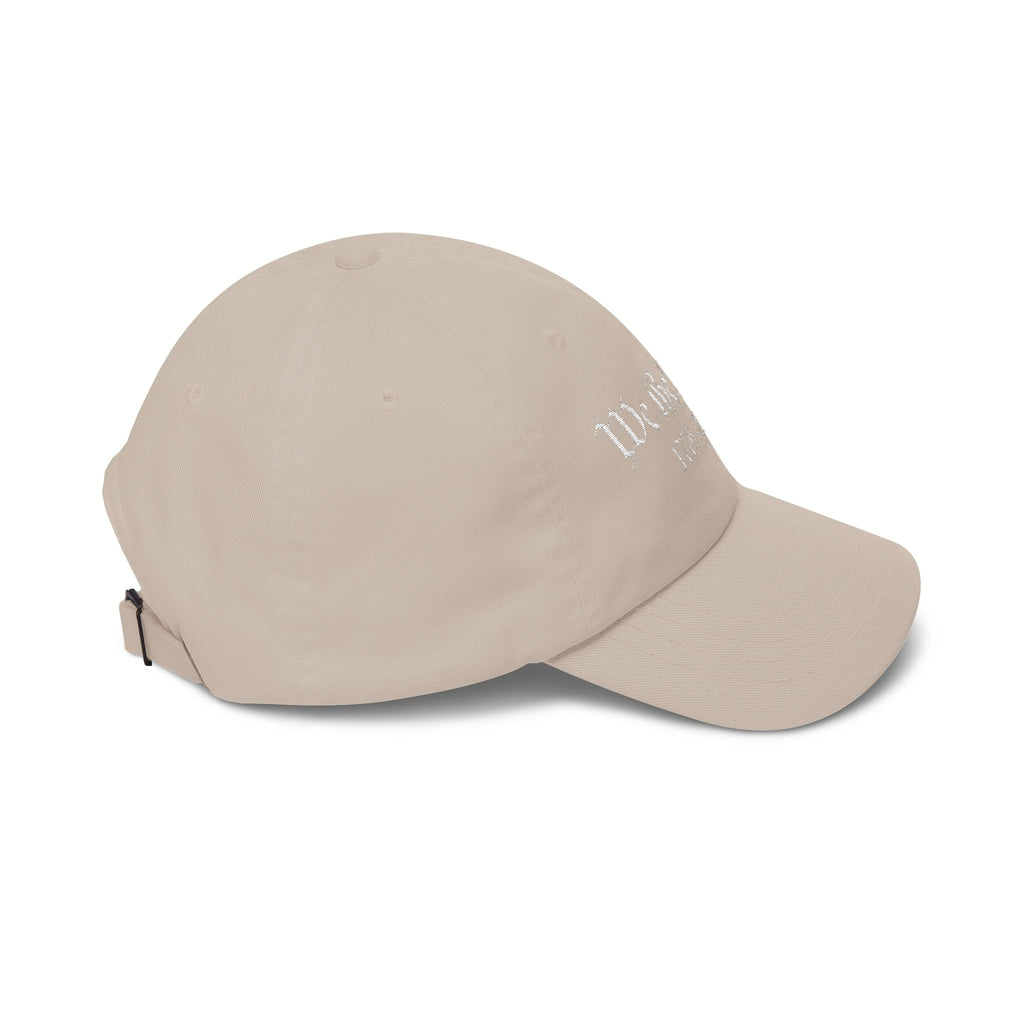 Side view of a stone-colored baseball cap 
