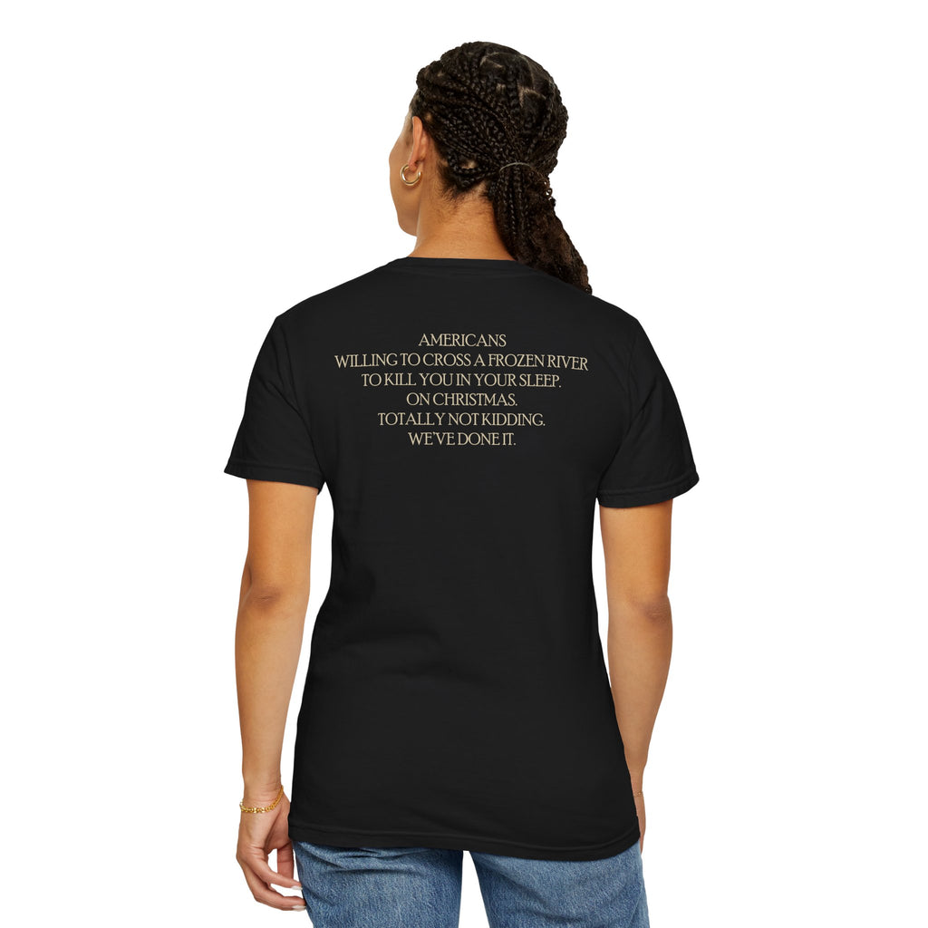Back of female model wearing America's First Christmas meme t-shirt with 'AMERICANS Willing to cross a frozen river to kill you in your sleep. On Christmas.' quote. Black