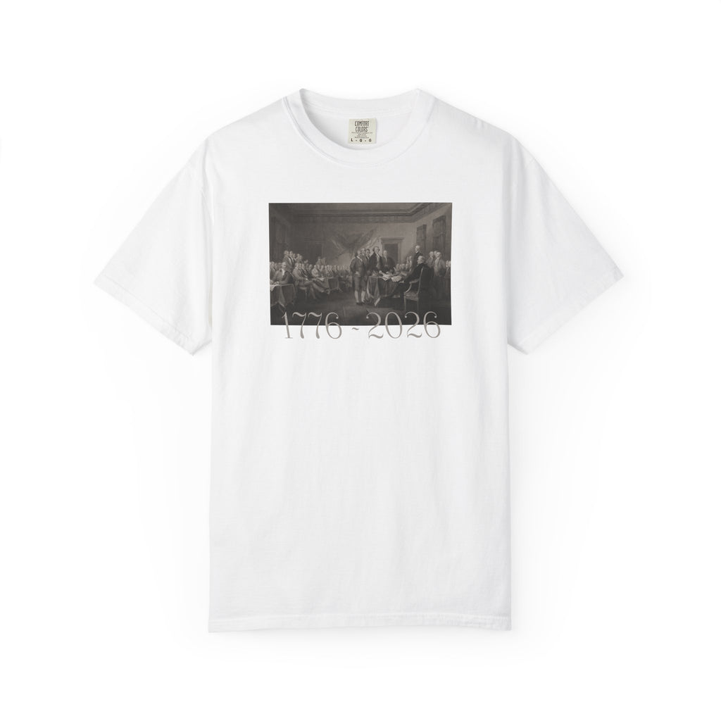 White Comfort Colors t-shirt with a printed design of Trumbull's  'Declaration of Independence' painting with '1776-2026' in overlapping revolutionary era text