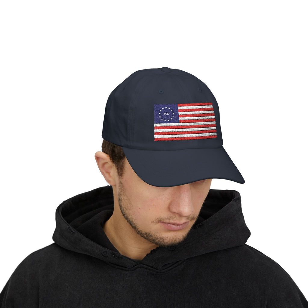 Man wearing navy dad cap embroidered with Betsy Ross Flag