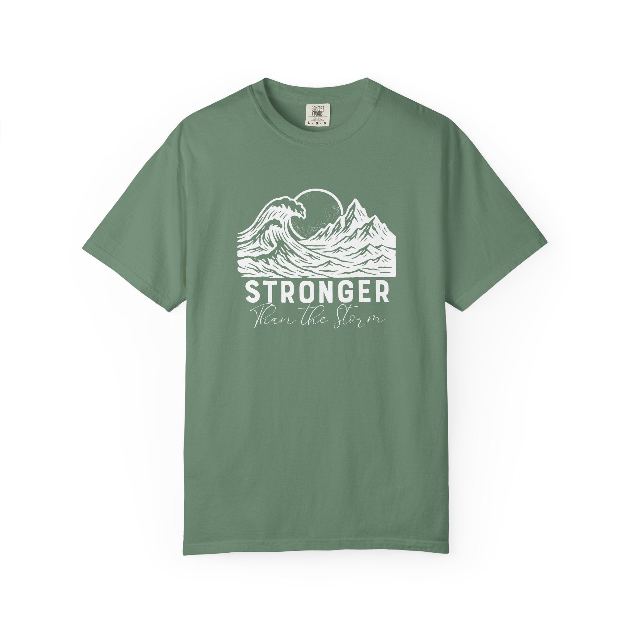 Stronger Than The Storm Christian t-shirt in light green with a mountain wave sun design