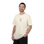 Smiling man wearing an Ivory Comfort Colors t-shirt with "Blessed are the Peacemakers" + dove embroidered with cornflower blue thread
