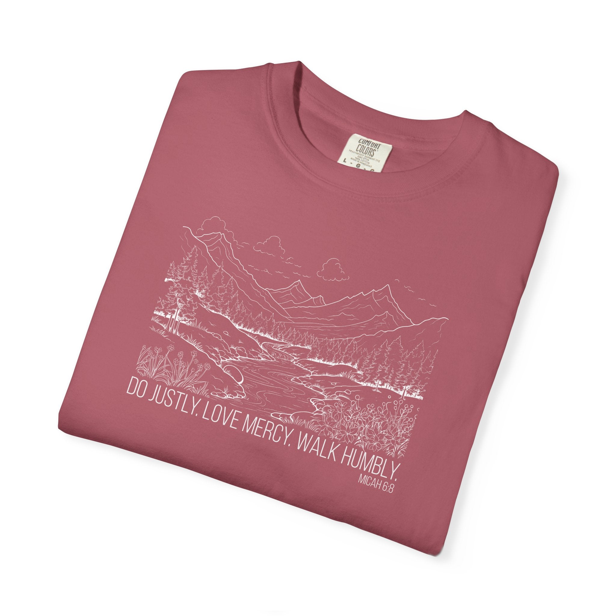 Folded Crimson Comfort Colors t-shirt with mountain river design and Bible verse from Micah 6:8