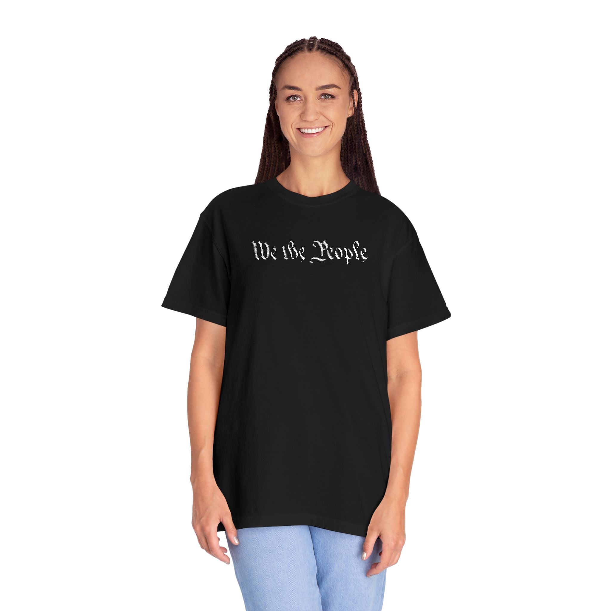 Smiling woman wearing oversized 'We the People' embroidered t-shirt in black