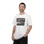 Man wearing a White Comfort Colors t-shirt printed with a montage of four revolutionary war era paintings