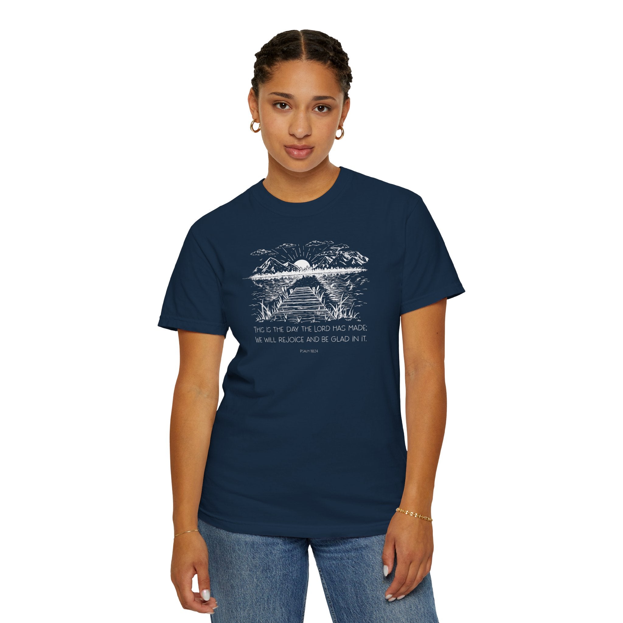 Woman wearing True Navy Comfort Colors t-shirt with nature graphic and 'This is the day the Lord has made; We will rejoice and be glad in it' below