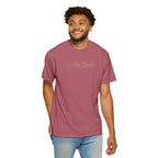 Smiling man wearing 'We the People' embroidered t-shirt in crimson