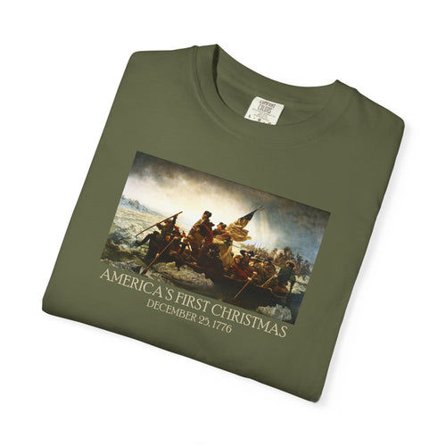 Folded Hemp Comfort Colors t-shirt with print of Emanuel Leutze’s 'Washington Crossing the Delaware' with 'America's First Christmas December 25, 1776' printed below 