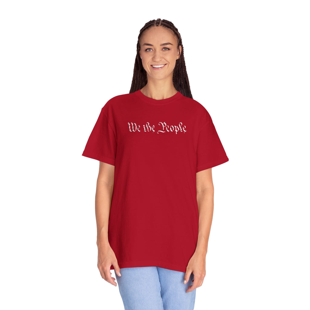 Smiling woman wearing oversized 'We the People' embroidered t-shirt in red