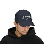 Man wearing a '1776' embroidered dad cap in Navy