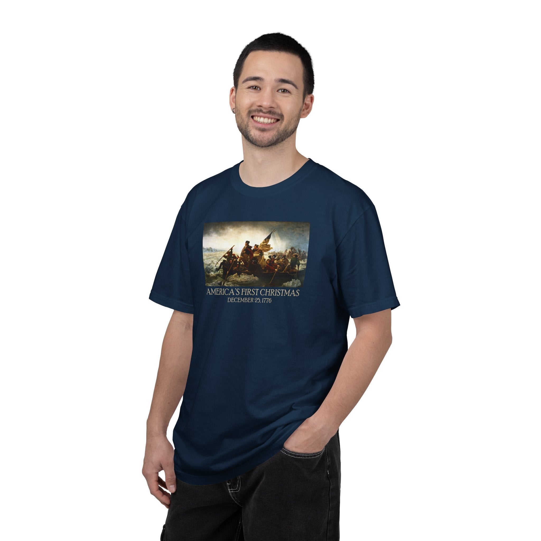 Smiling man wearing a True Navy Comfort Colors t-shirt with print of Emanuel Leutze’s 'Washington Crossing the Delaware' with 'America's First Christmas December 25, 1776' printed below 