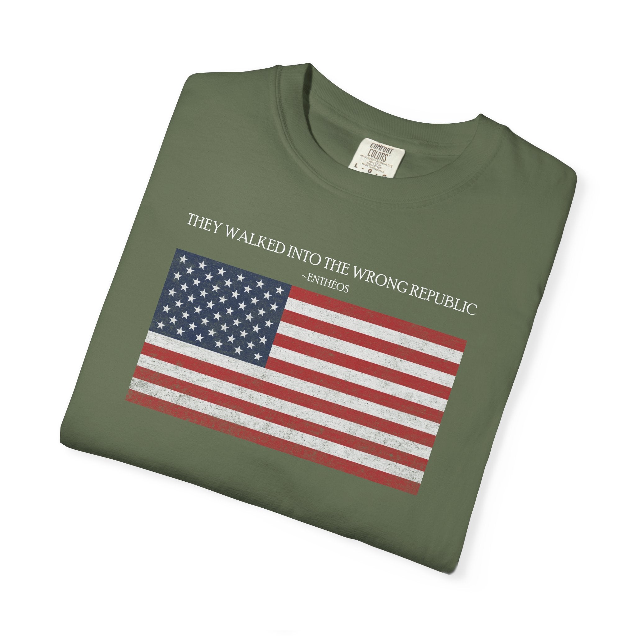 Folded Sage Comfort Colors t-shirt with distressed American flag graphic and 'They Walked Into the Wrong Republic' quote from Entheos