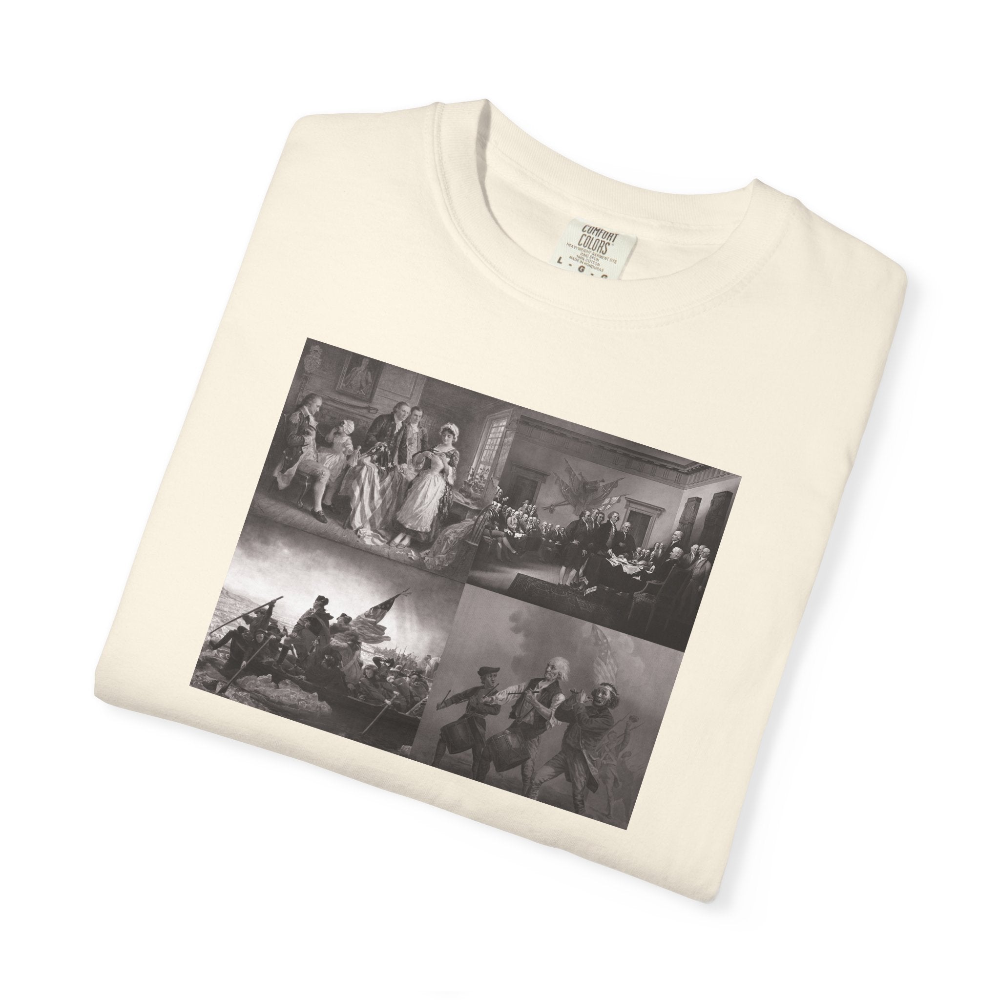 Folded Ivory Comfort Colors t-shirt printed with a montage of four revolutionary war era paintings