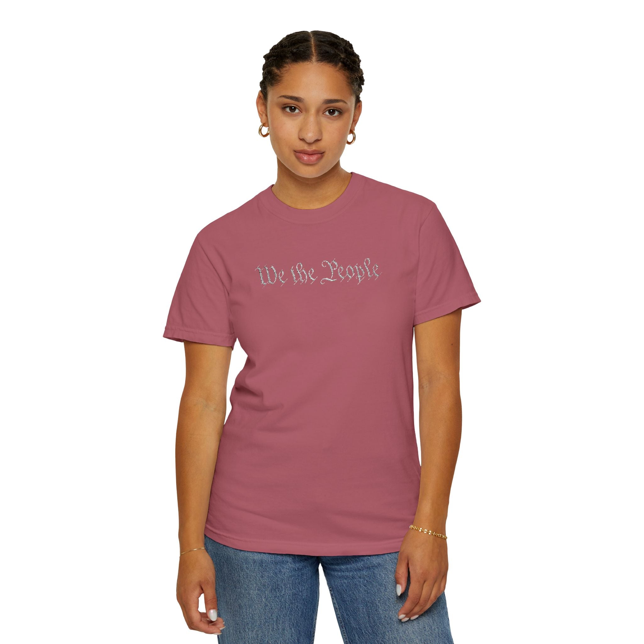 Woman wearing 'We the People' embroidered t-shirt in crimson