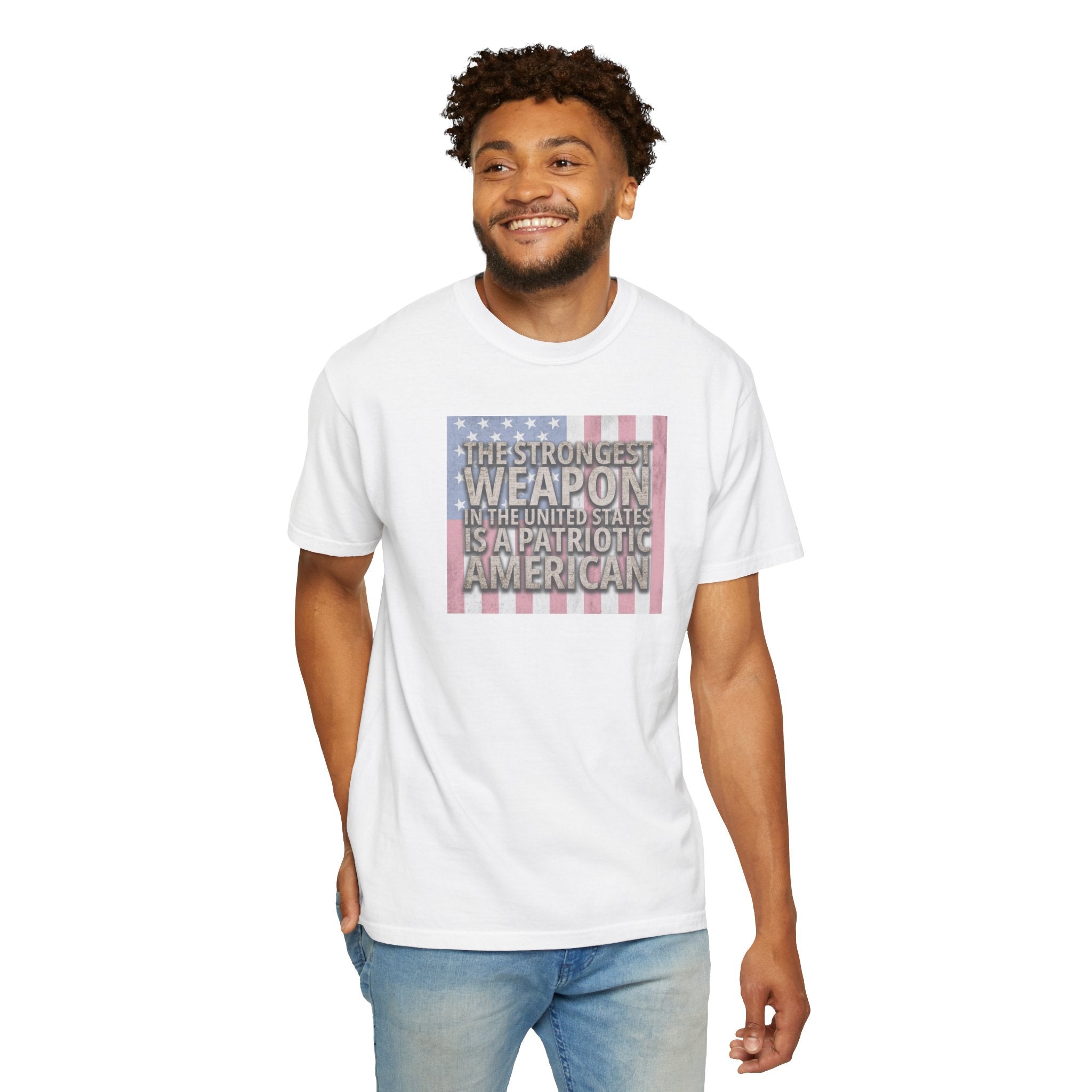 Smiling man wearing 'The Strongest Weapon in the United States is a Patriotic American' t-shirt in white