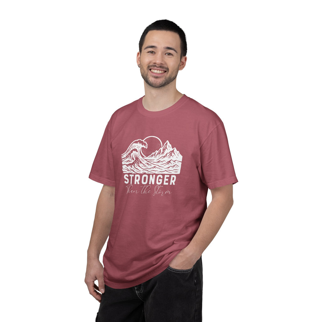 Man wearing Stronger Than The Storm faith t-shirt in crimson 