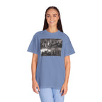 Woman wearing an oversized Washed Denim Comfort Colors t-shirt printed with a montage of four revolutionary war era paintings