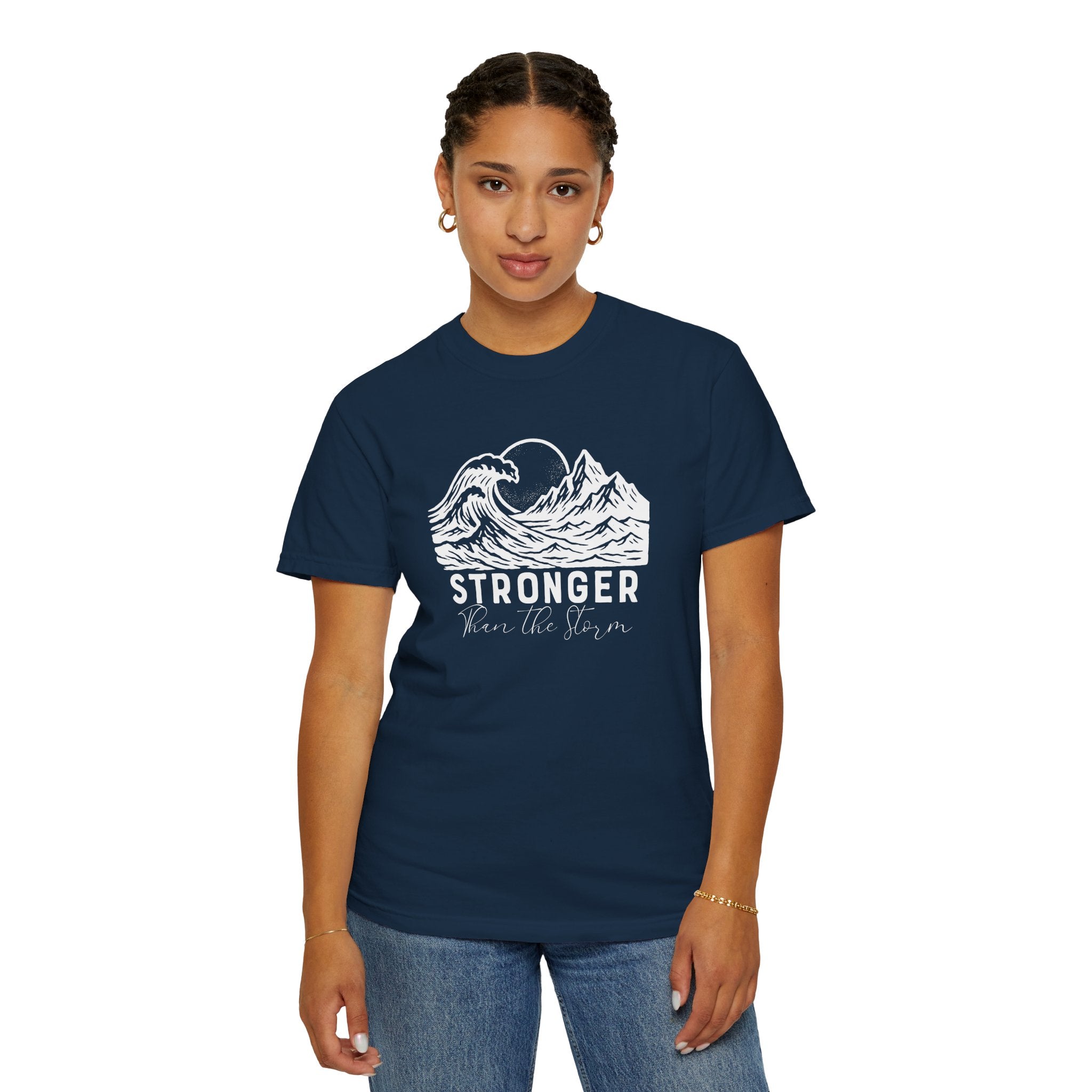 Person wearing Stronger Than The Storm faith t-shirt in true navy