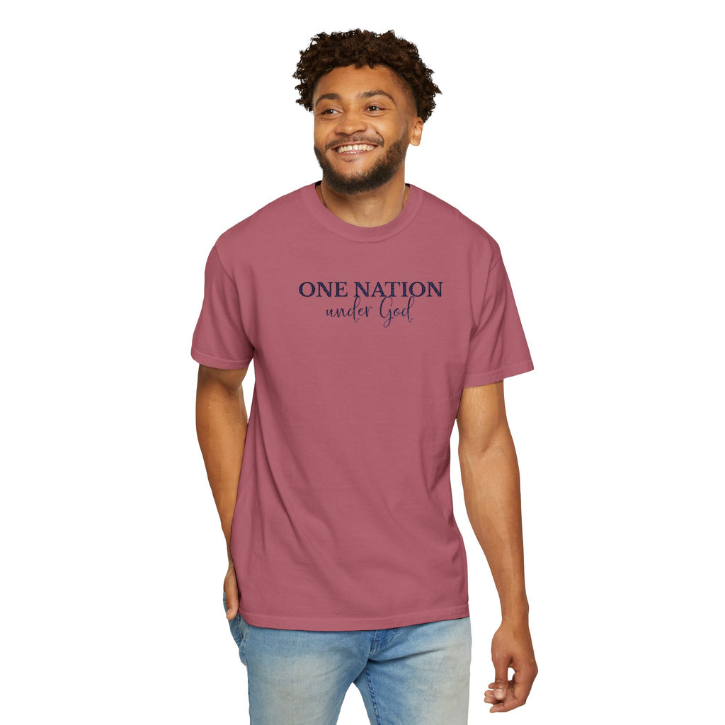 Smiling man wearing a Crimson Comfort Colors t-shirt with 'One Nation under God' embroidered in blue thread