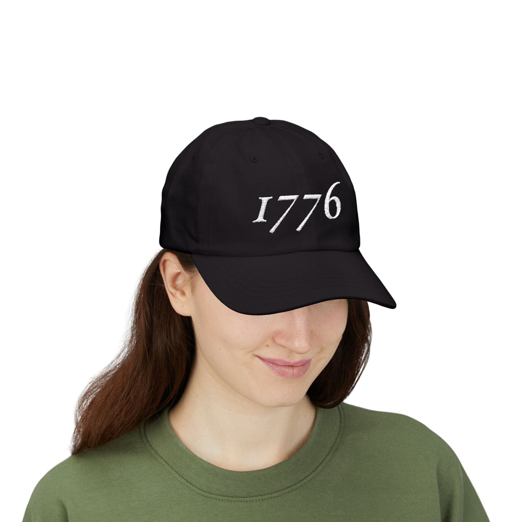Front view of woman wearing a Black dad cap embroidered with '1776'