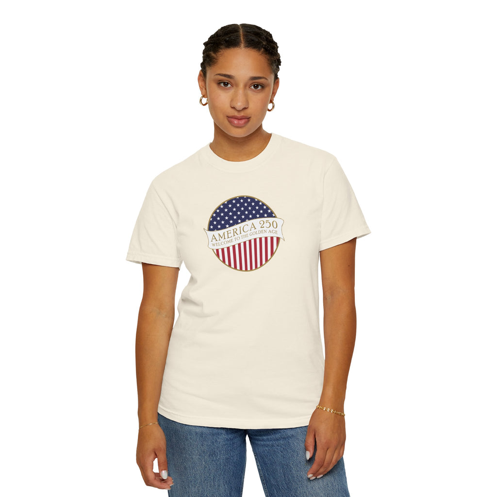 Woman wearing an Ivory Comfort Colors t-shirt with an America 250 design with text 'America 250 Welcome to the Golden Age'
