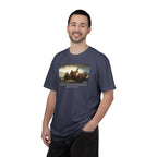 Smiling man wearing a Denim Comfort Colors t-shirt with print of Emanuel Leutze’s 'Washington Crossing the Delaware' with 'America's First Christmas December 25, 1776' printed below 
