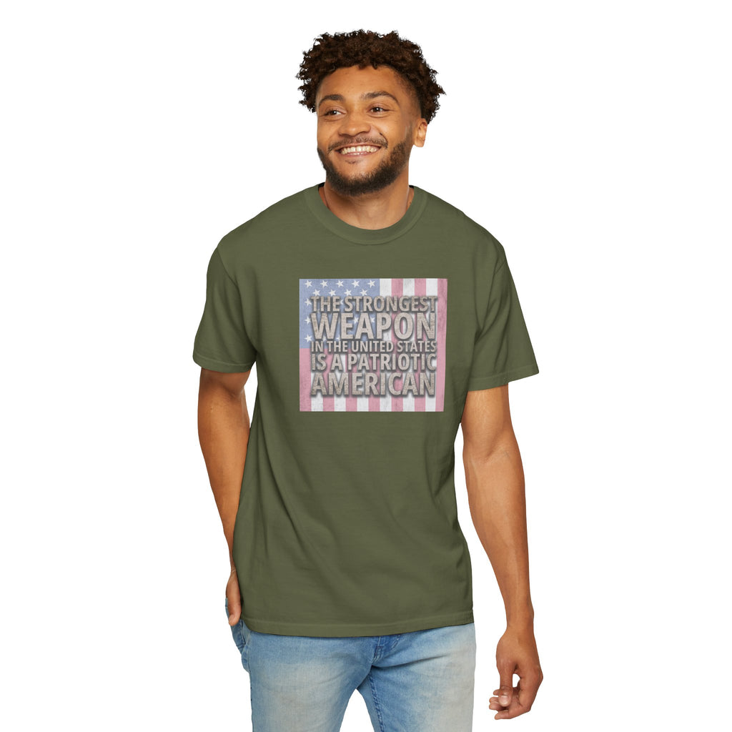 Smiling man wearing 'The Strongest Weapon in the United States is a Patriotic American' t-shirt in hemp