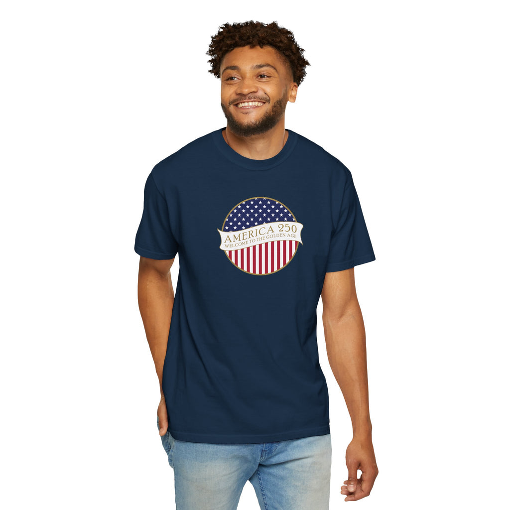 Smiling man wearing a True Navy Comfort Colors t-shirt with an America 250 design with text 'America 250 Welcome to the Golden Age'