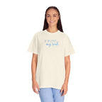 Smiling woman wearing an oversized Ivory Comfort Colors t-shirt with 'He restores my soul' embroidered in cornflower blue thread