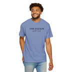 Smiling man wearing a Washed Denim Comfort Colors t-shirt with 'One Nation under God' embroidered in blue thread