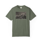 Moss Comfort Colors t-shirt with a printed design of Trumbull's  'Declaration of Independence' painting with '1776-2026' in overlapping revolutionary era text