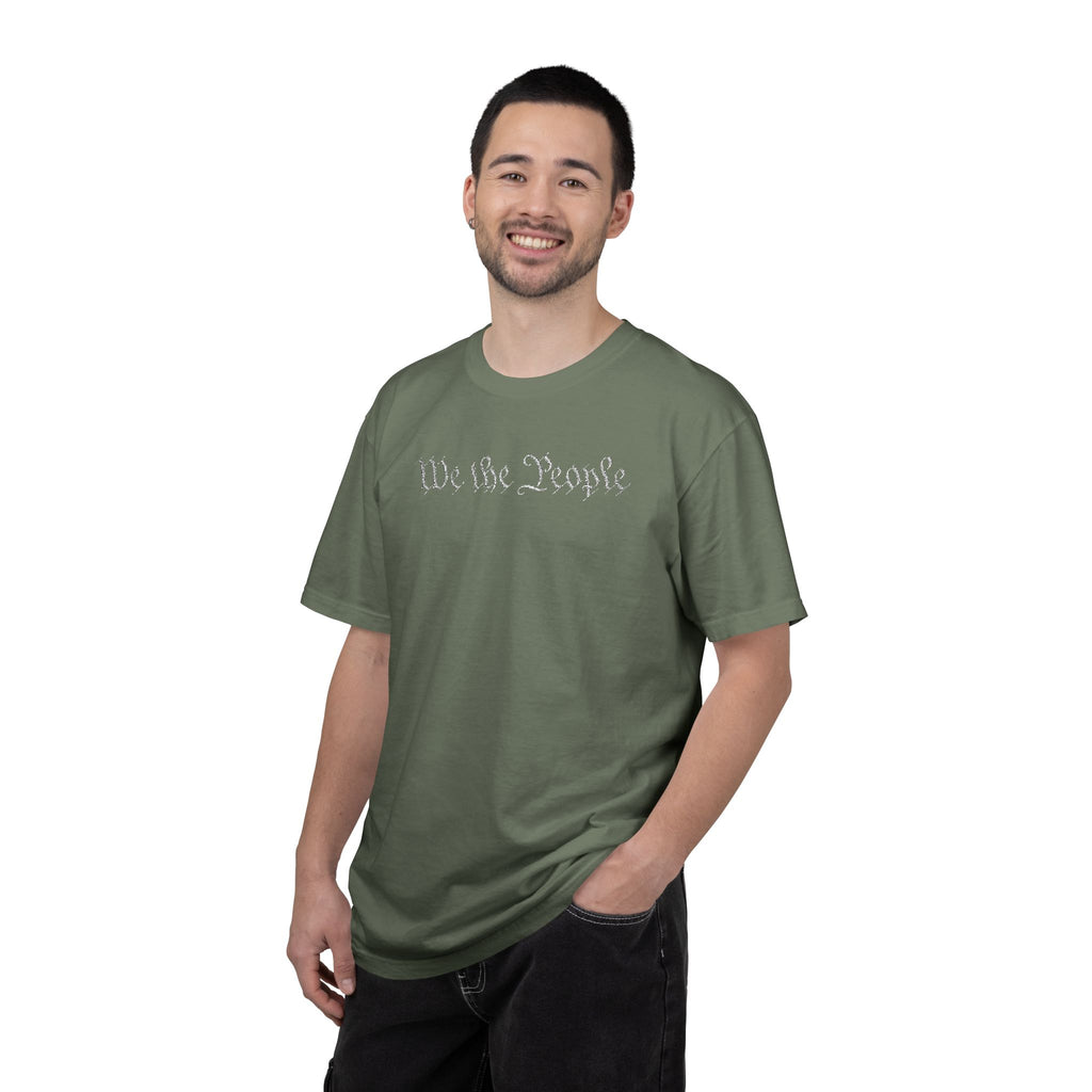 Man wearing 'We the People' embroidered t-shirt in moss