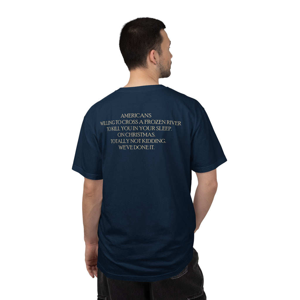 Back view of male model wearing America's First Christmas meme t-shirt with 'AMERICANS Willing to cross a frozen river to kill you in your sleep. On Christmas.' quote. True Navy