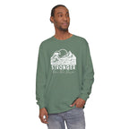 Male model in Stronger Than The Storm Christian long sleeve tee in light green