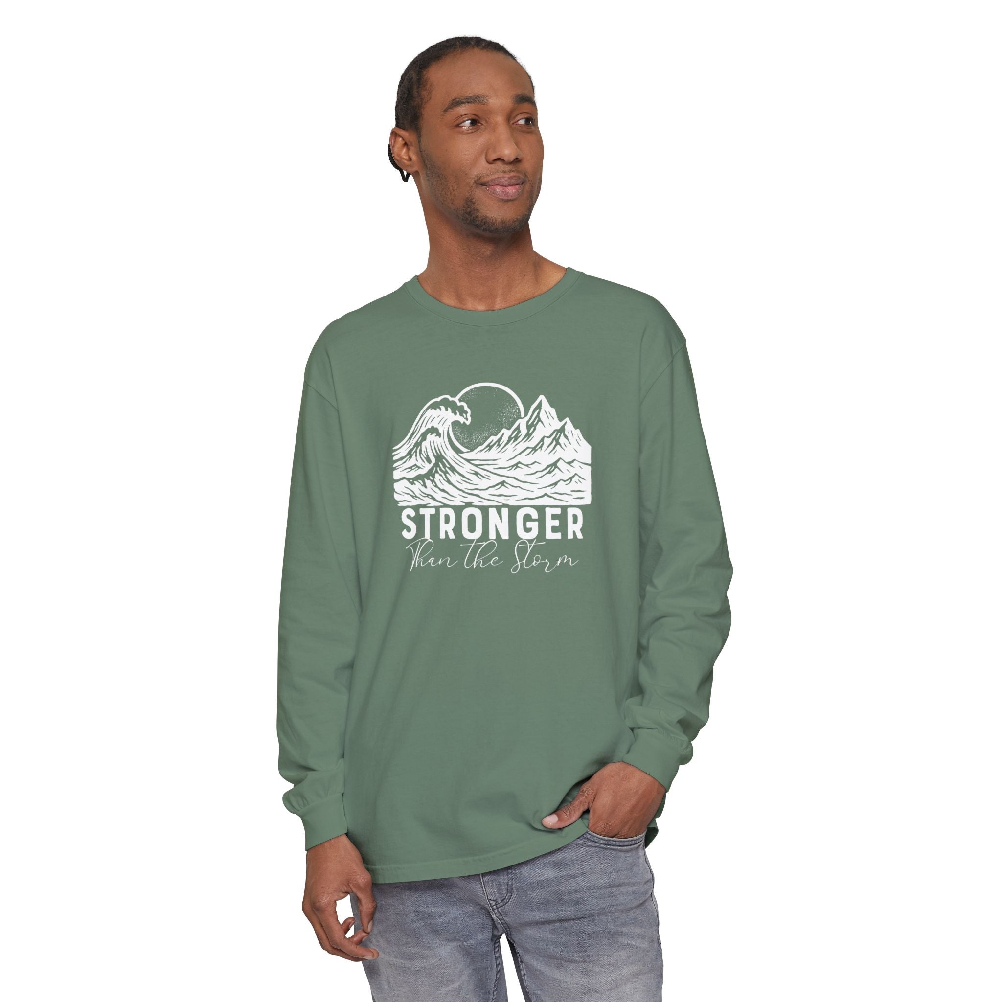Male model in Stronger Than The Storm Christian long sleeve tee in light green