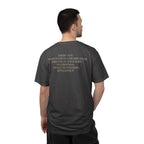 Back view of male model wearing America's First Christmas meme t-shirt with 'AMERICANS Willing to cross a frozen river to kill you in your sleep. On Christmas.' quote. Graphite