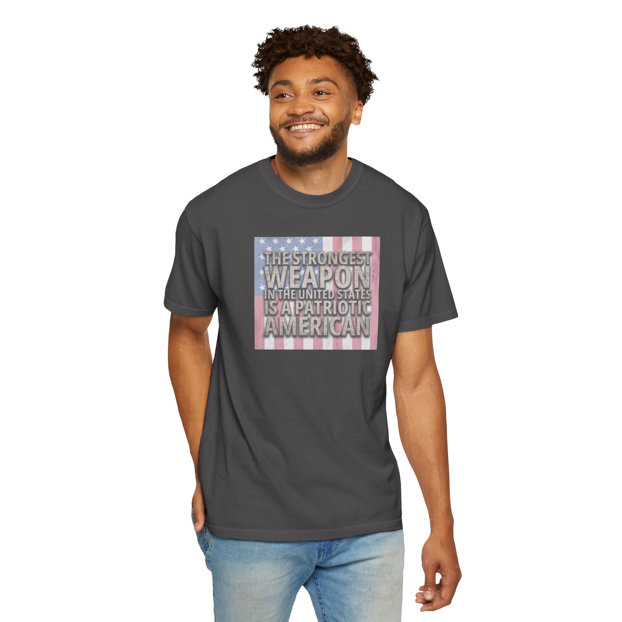 Smiling man wearing 'The Strongest Weapon in the United States is a Patriotic American' t-shirt in graphite