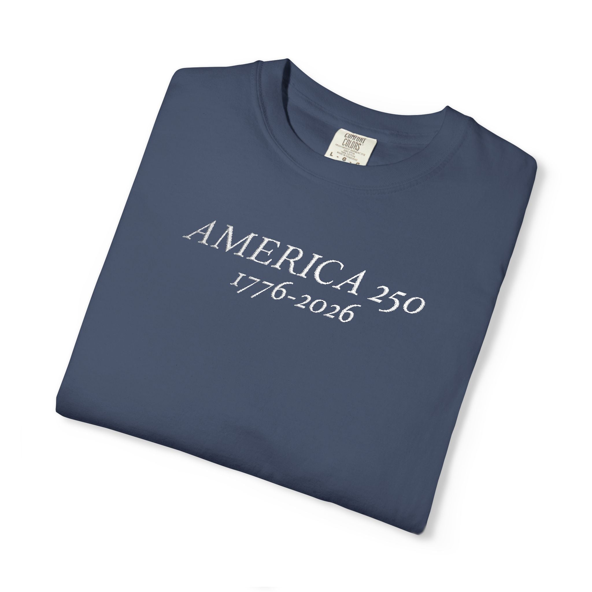 Folded Midnight Comfort Colors t-shirt with 'AMERICA 250 1776-2026' embroidered in white thread