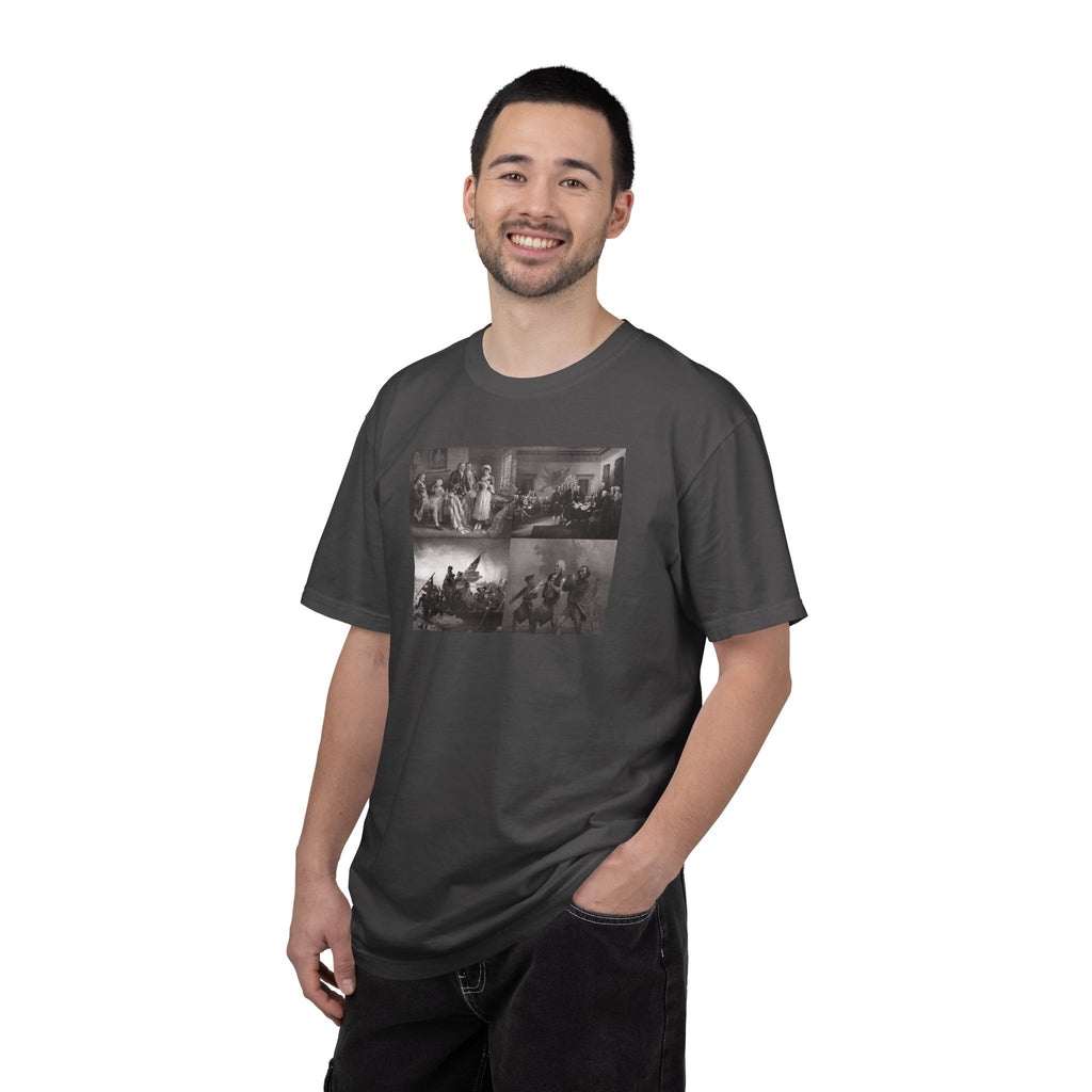 Man wearing a Graphite Comfort Colors t-shirt printed with a montage of four revolutionary war era paintings