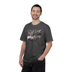 Man wearing a Graphite Comfort Colors t-shirt printed with a montage of four revolutionary war era paintings