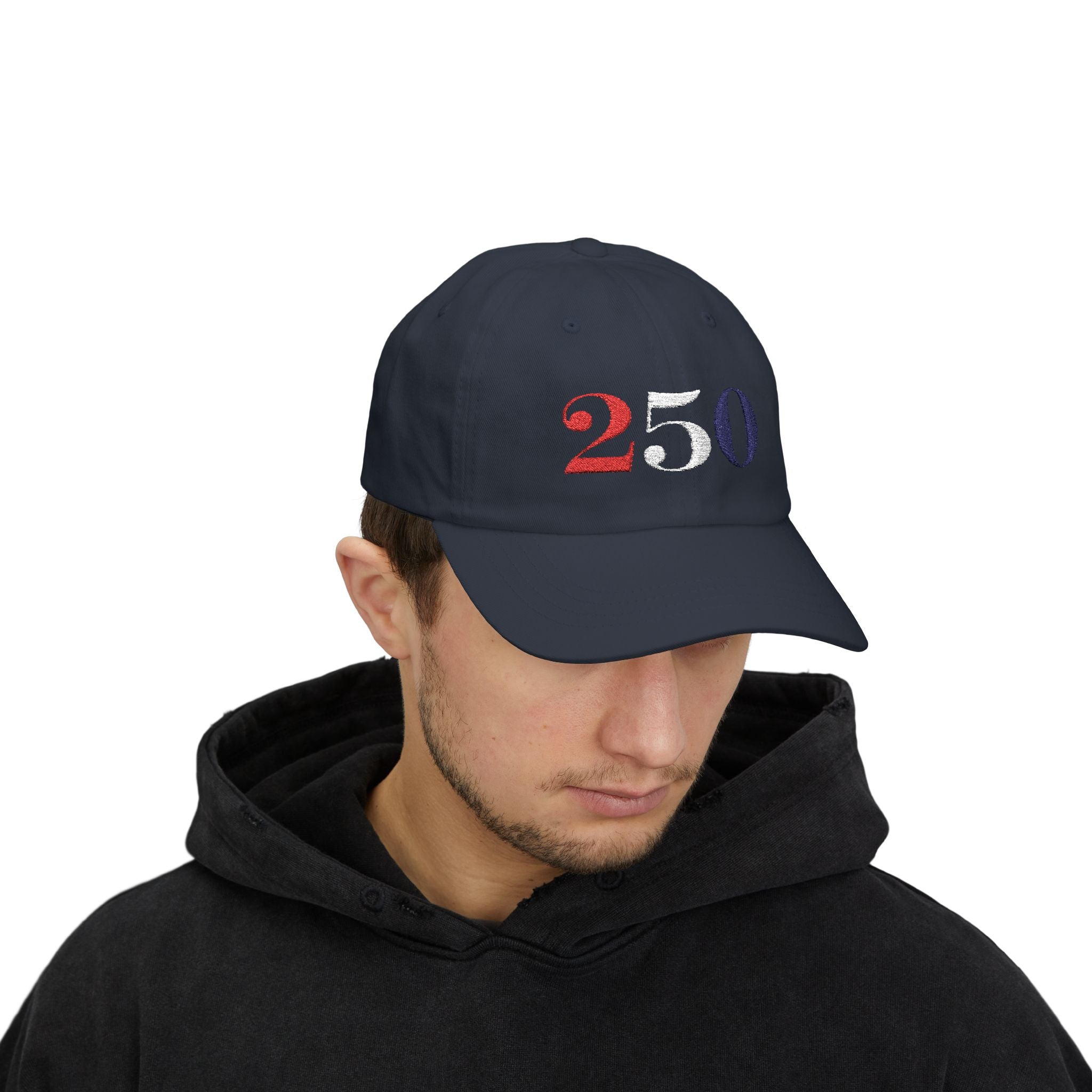 Male model wearing embroidered America 250 bold embroidered dad cap in navy