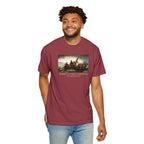 Man wearing a Chili Comfort Colors t-shirt with print of Emanuel Leutze’s 'Washington Crossing the Delaware' with 'America's First Christmas December 25, 1776' printed below 